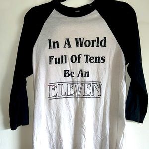 Stranger Things “in a world full of tens be an eleven” medium baseball tee.
